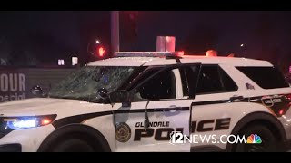 VIDEO: Suspect in mask jumps into Glendale police car, drives it during West Valley protest