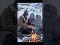 cold snowy village, a family prepares food and sits together outside their small home#lastholiday