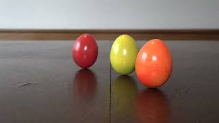 Mesmerizing Egg Spin Experiment: Watch Three Colored Eggs Rise with Inertia