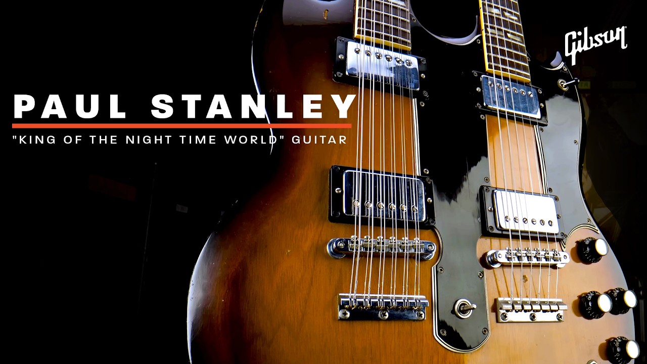 Paul Stanley shows Mark Agnesi his "King of the Night Time World" guitar