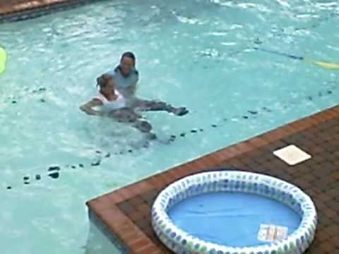 Diane and Colleen jumping into pool with clothes on