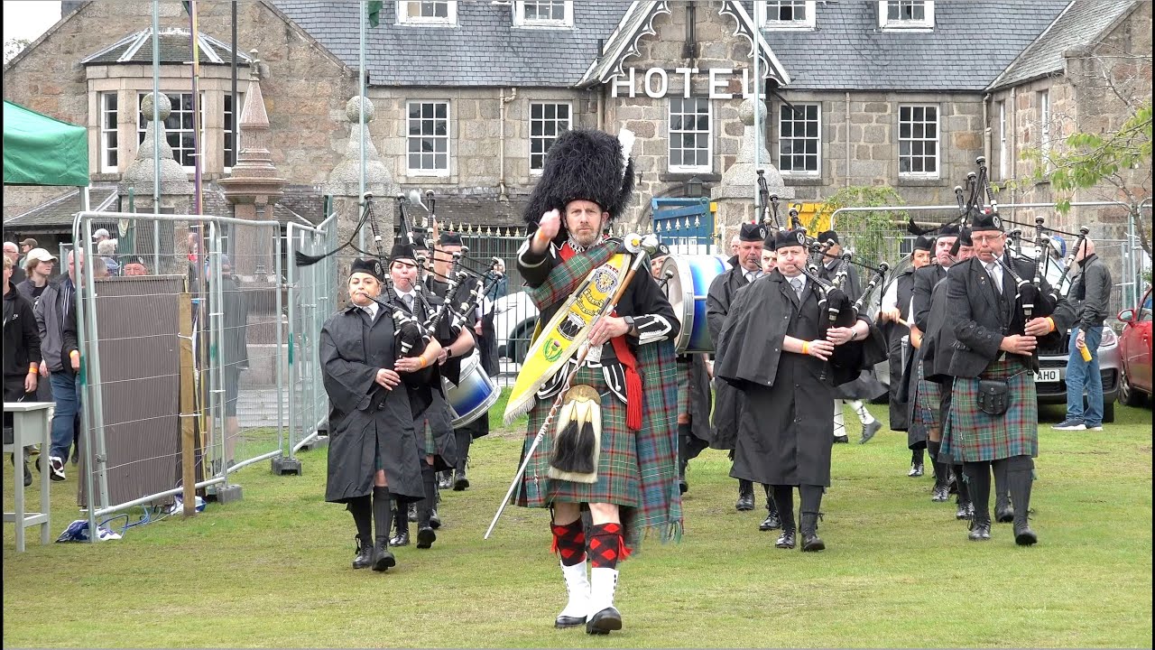 Drum Major Michie leads Ellon & District RBL Pipe Band on the march into 2023 Aboyne Highland Games