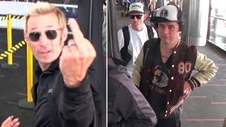 See How Green Day Bassist Mike Dirnt Reacts When They Get Papparazi'd At LAX
