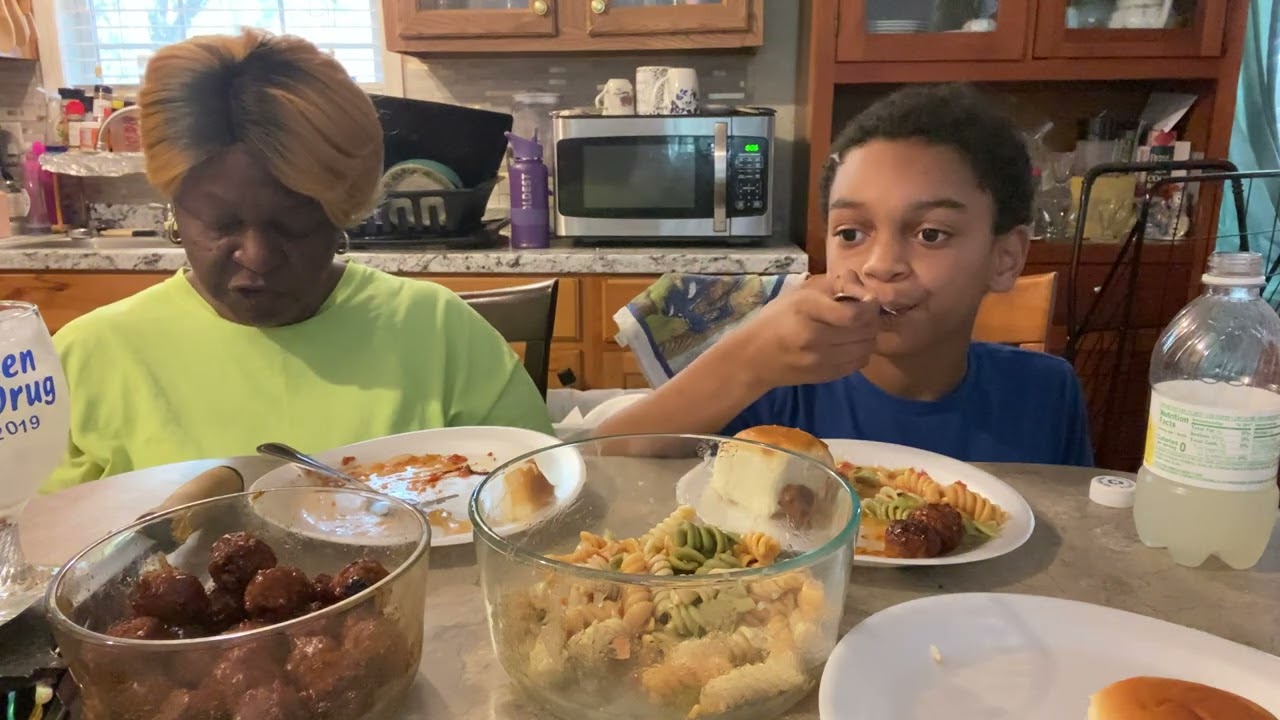 Pasta, salad, meatballs, and Hawaiian rolls
