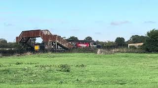 From left to right 37884 crawls slowly under the footbridge 22/09/2026