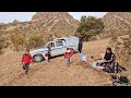 Rural couple cooperate in collecting firewood for winter