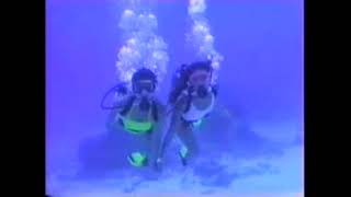 Two Female Scuba Divers Diving Together