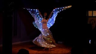 LED wings belly dance at holiday party