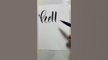 Write hello in calligraphy using brush pen #calligraphyart , #brushlettering , #shorts,