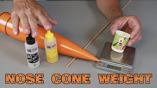 Adding nose cone weight to a rocket.