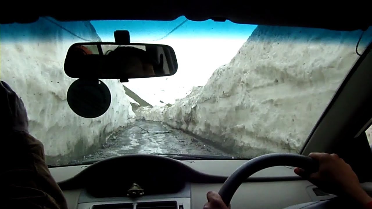 Driving through a snow tunnel in the Himalayas (Kashmir, India)