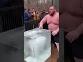 Strong man tried to smash the glass and break a giant ice cube… but failed.