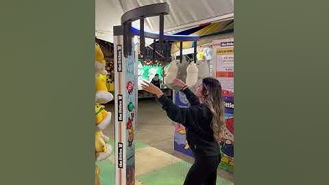 Girl is attempting to play the stick catching game!