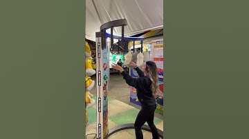 Girl is attempting to play the stick catching game!