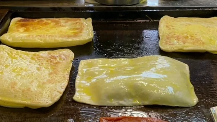 Crispy egg-stuffed, pancake aroma fills the air!