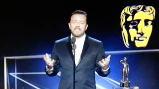 Ricky Gervais appears to laugh at his OWN acceptance speech at the BAFTA Britannias