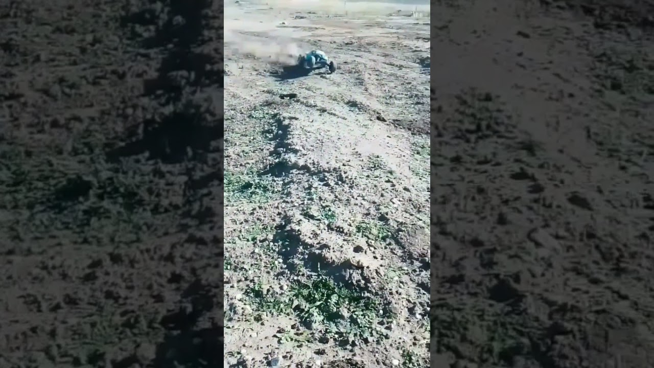 Traxxas bandit vxl with bug body ripping in slow motion 