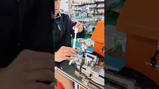 Fold-over wire labeling machine for labeling plastic handles#labelingmachine #labeler