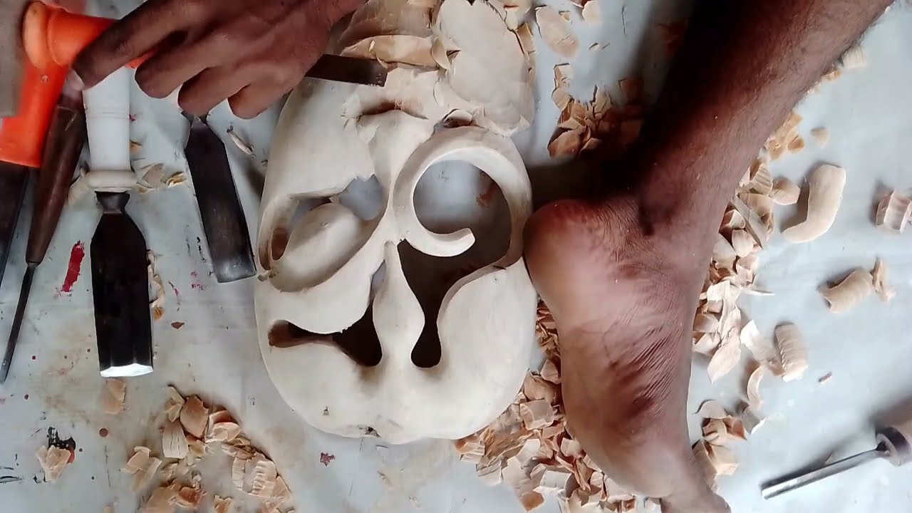 women  face wood carving tribal mask