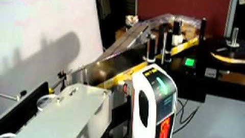 Laser Coder Integrated with Label Applicator