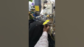 Automatic loop attaching machine |