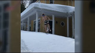 Guy Tries To Snowboard Off Of The Roof