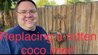Replacing a coco liner in a wall basket and planting it for summer.