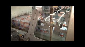 Prasmatic TC 400C combination case packer with double continuous rotator by Robopac USA