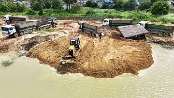 Nice View Land Filling Up Bulldoze CAT D3K Pushing Dirt Into Water Dump Truck Unloading Soil Skills