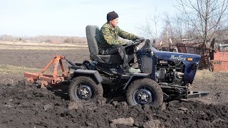 Plowing the garden. Tractor is broken down