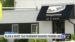 Black & White Taxi Penger Damages Ping Car