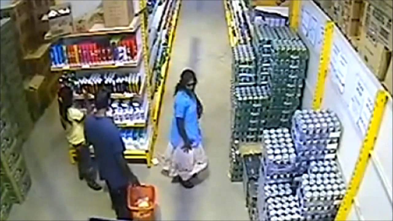 Woman steals beer under her skirt.wmv YouTube