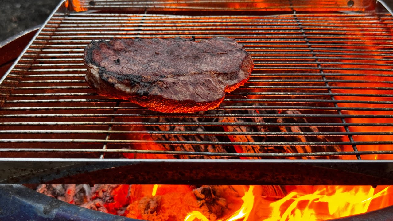 Cooking steak on the Solo Stove Yukon 2.0 - Cooking Outdoors