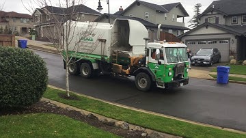 Hoodview and WM garbage trucks
