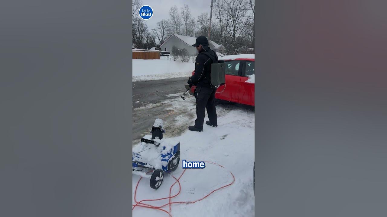 Man gets rid of snow with a flamethrower