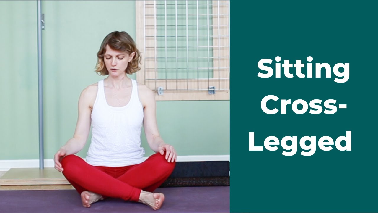 Happy man sitting in a cross-legged yoga pose Stock Photo - Alamy