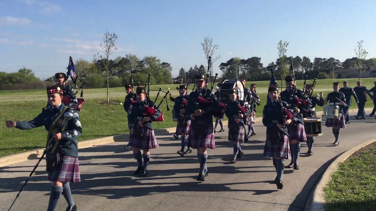 2017 05 band and drill team marching to competition from staging area