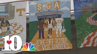 UT students drop banners at Neyland Stadium during homecoming week
