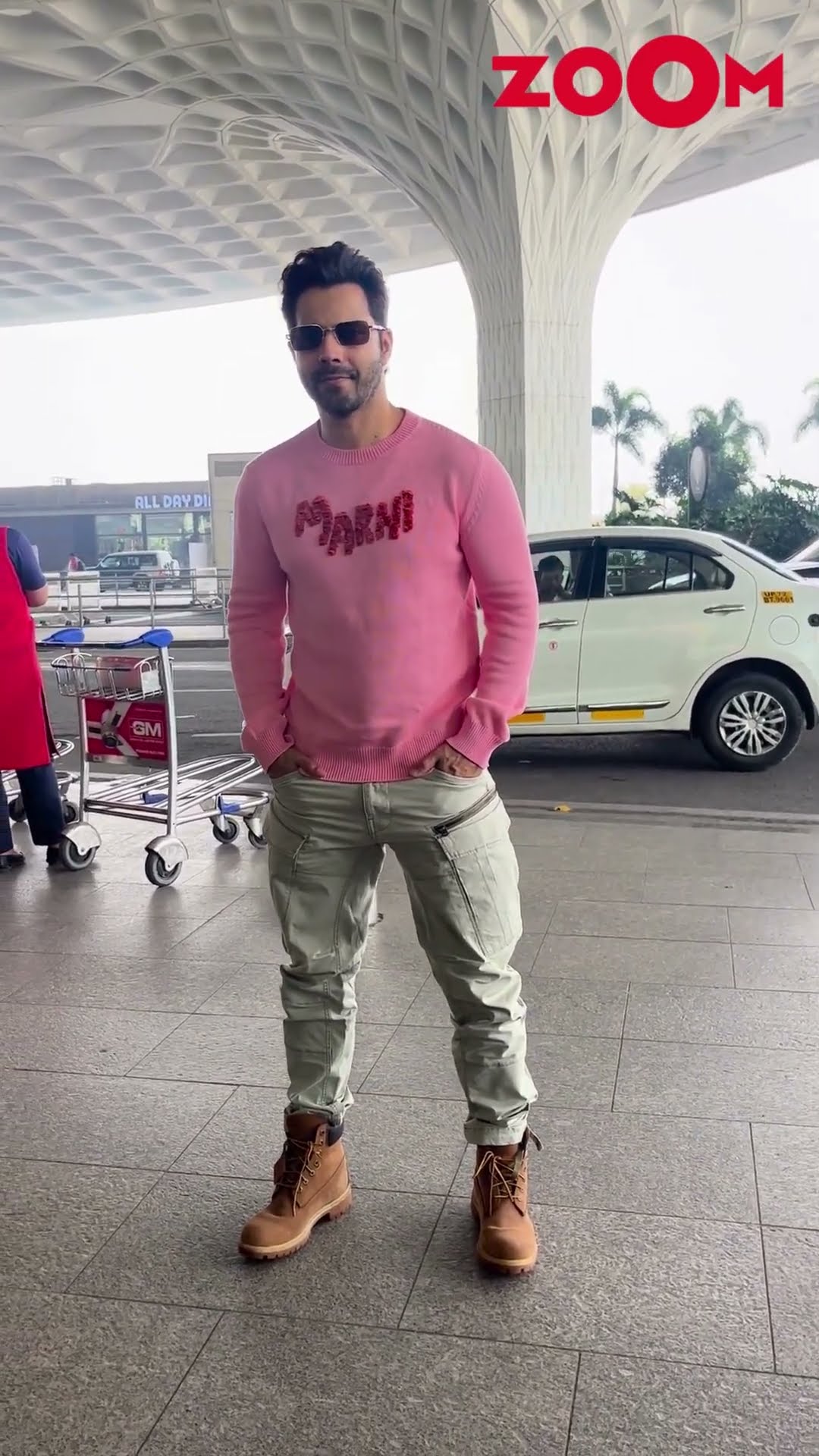 Varun Dhawan dashing POSE for the paps wearing a striking pink pullover #varundhawan #shorts