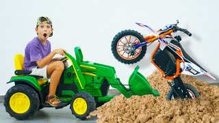 Artem Plays Toys with Tractor | Ride on Sportbike stuck in the sand  Using kids Tractor to get bike