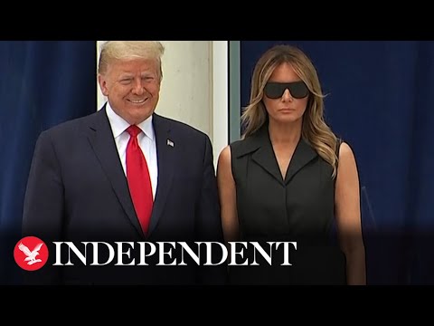 Trump appears to ask Melania to smile during visit to the Saint John Paul II National Shrine