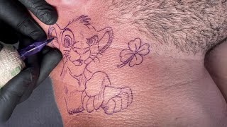 Simba tattoo on neck