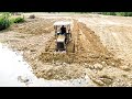 Wonderful Mini Bulldozer Pushing Dirt Mud Into Deep Water Filling Up Land