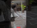 Hand - Scrubbed Tile Surface Cleaning for Perfect Floor Finishing in Residential Outdoor Areas
