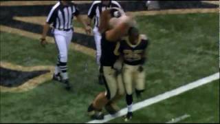 Reggie Bush runs over Gumbo the Dog after the Saints win the 2009 NFC Championship