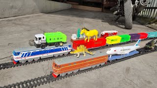 Looking for and assembling toys Diesel trains Cars Garbage trucks Airplanes Dinosaurs Helicopters