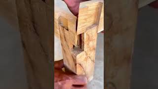 assembling traditional wooden joint pieces with a very neat complex interlocking puzzle method
