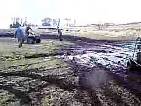 3 guys and a snow sled going through some sweet mud!!!