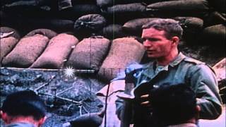 US troops burn enemy hideouts using flamethrowers on Iwo Jima. HD Stock Footage