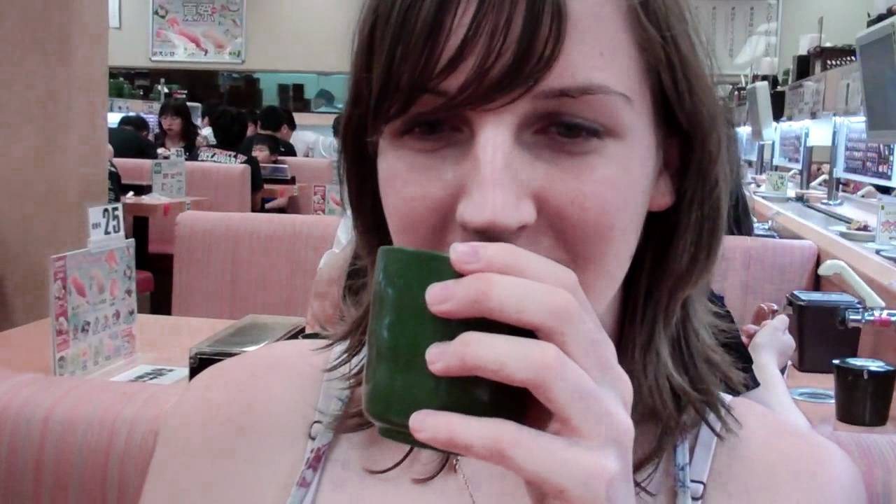 Yuya and Liz at a sushi place in Japan